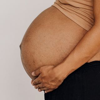 How is the baby positioned in the womb?