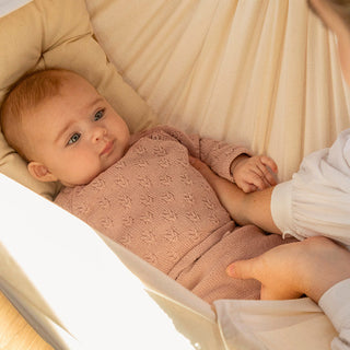 When can babies hold their head up?